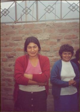 W.H.O. Trip, Ayacucho, Peru - Two unidentified women standing in front of brick wall