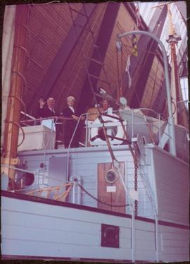 Iona Campagnolo and two unidentified men smile from the top deck of the RCMP St. Roch, Vancouver ...