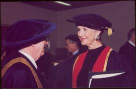 Honourary Doctor of Laws, Brock University - Iona Campagnolo speaking with unidentified man, both in regalia