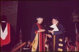Honourary Doctor of Laws, Brock University - Iona Campagnolo accepting the honorary doctorate degree from an unidentified man