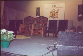 Close view of ceremonial chairs onstage in front of UNBC banners, May 1994