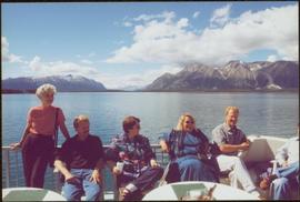 Chancellor's Tour - Iona Campagnolo sits with group on upper deck of the 'Theresa' houseboat in Atlin, BC