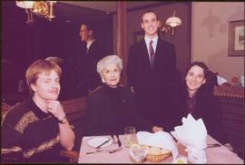 Chancellor's Farewell - Iona Campagnolo sitting at dinner table with 3 unidentified individuals believed to students