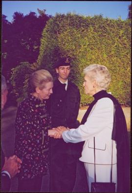 Countess Aline Dobrzensky and Lieutenant Governor Iona Campagnolo shaking hands at Dobrzensky’s G...