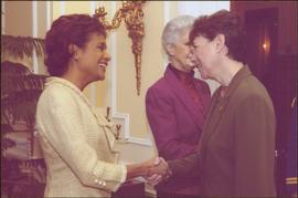 Governor General Michaëlle Jean shaking hands with an unidentified woman wearing a green suit, Li...
