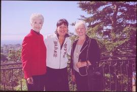 Lieutenant Governor Iona Campagnolo, Dorothy Grant, and Carole Sabiston standing on a balcony