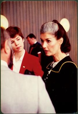 Iona Campagnolo speaking with an unidentified and man woman at an unknown event