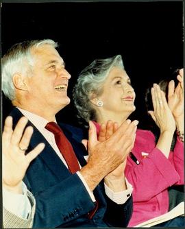 Close view of an unidentified man and Iona Campagnolo clapping