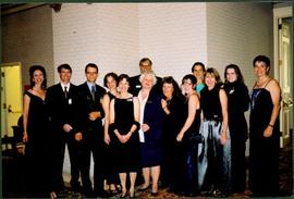 Group photo of ten unidentified women and three unidentified men, all in formal wear