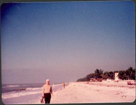 Unidentified man standing on a beach