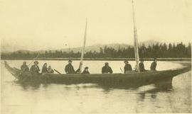 Marion & W.H. Collison in canoe with Tsimshian and Haida crew, travelling from Masset, BC