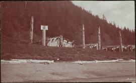 Totem poles and houses at Kaisun, Queen Charlotte Islands, BC