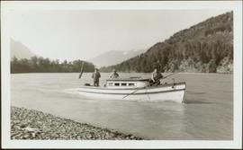 W.E. Collison travelling by boat on business trip up Nass River, BC