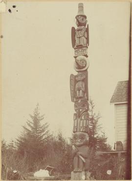 Tlingit totem pole at unidentified house