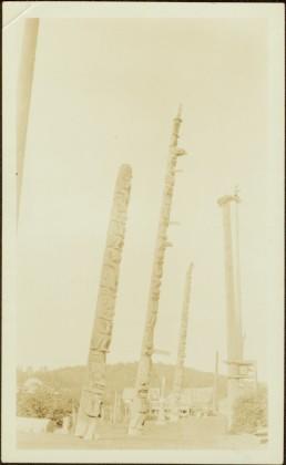 Totem and Mortuary Poles in an unidentified village
