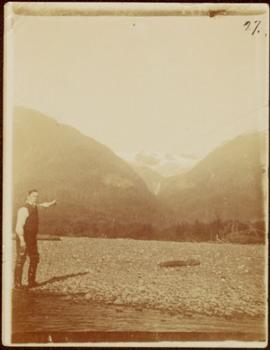 W.H. Collison Points to a Mountain Pass