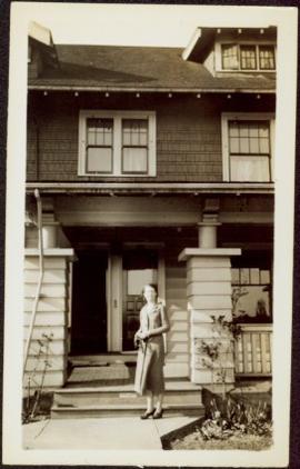 Woman in front of House