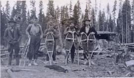 Several men standing with their snow shoes