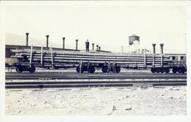 Grand Trunk Pacific flatbed train car carrying logs