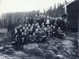 Group portrait of men on rocky outcropping