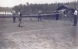 Four men playing tennis