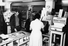 1965 - Unknown Woman & Men in Company Store