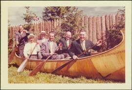 Cabinet members in canoe