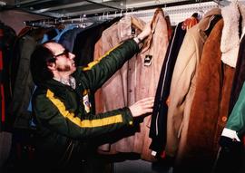 Community Album - Unidentified Man Browsing through New Coats