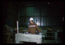 Prince George (P.G.) Sawmill - General - Stuart Sing at planer feeder console