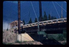 Woods Division - Bridges - Logging truck approaching McGregor River suspension bridge