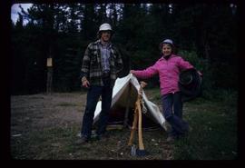 Woods Division - Timbercruising - Two unidentified individuals standing outside small tent