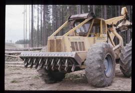 Woods Division - Delimbing - Comb type delimber at B & R operation on 667 skidder