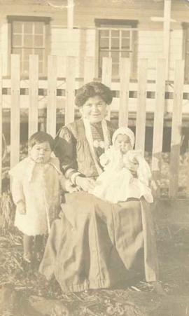 First Nations woman with a young child and an infant