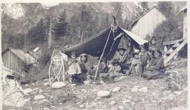 First Nations family in front of a tent