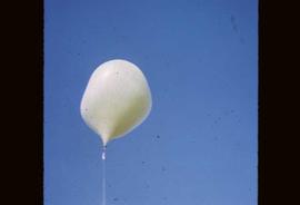 A weather balloon ascending into the air