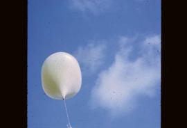 A weather balloon rising