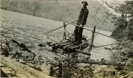 A man standing on a raft