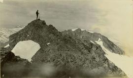 Man on top of a mountain