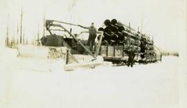 Bulldozer freighting in supplies during winter