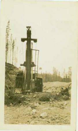 Close up of front end of steam shovel in the field