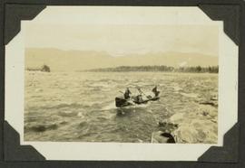 Survey crew and supplies on a canoe on the Finlay Rapids on the Peace River