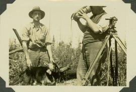 Reading stations with Wild Transit Theodolite. J.R.M. with Frank Swannell quenching thirst from T...