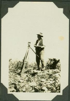 Frank Swannell surveying