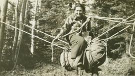 Josephine Daly riding a makeshift "horse"