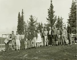Group photo of 15 men at Kinaskan Lake camp during a survey trip