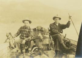 Mac McGarvey and Frank Dewing sitting in a boat on the Peace River