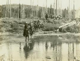 Crew men on horseback fording the South Pine River