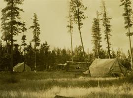 Camp No.3 situated next to a log home