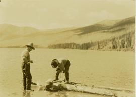 Pete Callao and Johnny Napolean building a raft on Muinok Lake