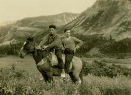 Pete Callao and Billy Taylor on the back of a pack horse